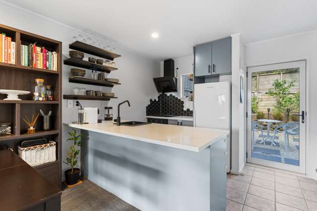 RENOVATED TWO-LEVEL UNIT. PRIVATE YARD, OWN GARAGE