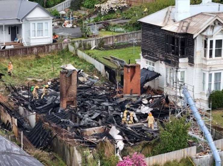 Fire consumes the former boarding house at 3 Phillips Street, in Kensington, Dunedin, in October 2023. Photo / Stephen Jaquiery