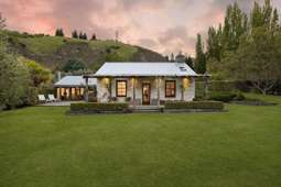 Queenstown tourism chief selling his historic Gibbston cottage