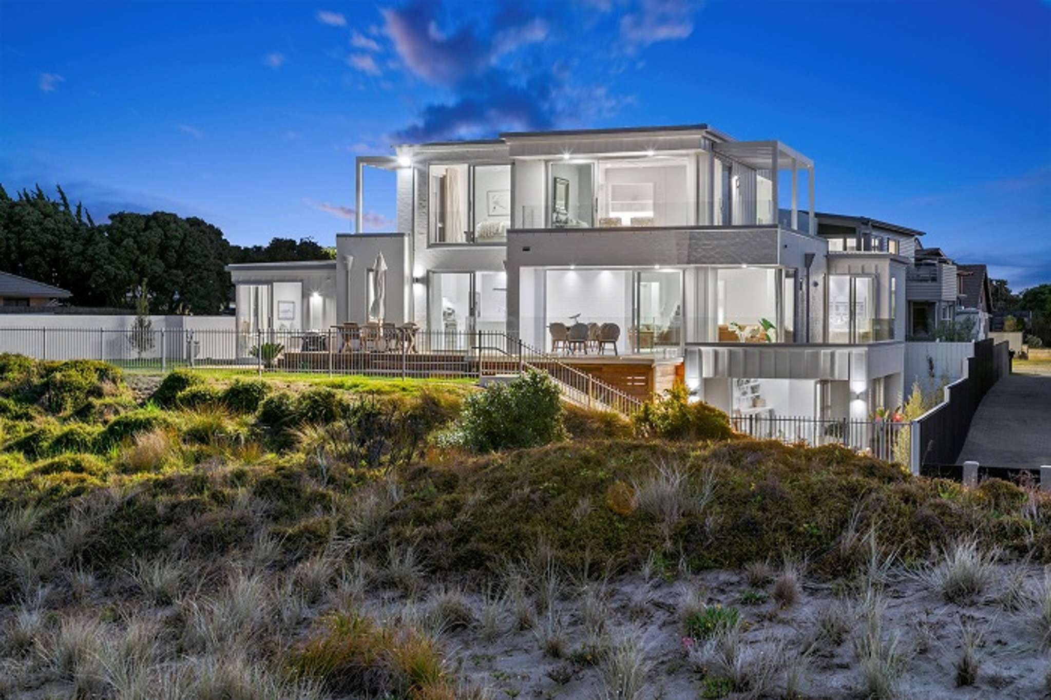 Expats snap up luxury Mt Maunganui home for $5.6m at ‘fast and furious’ auction