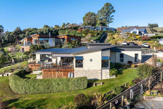 Sun soaked elegance with sweeping Taieri views