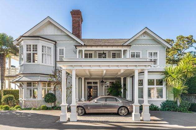 Cedar and white brick two-storied house with pool  294 Victoria Avenue remuera