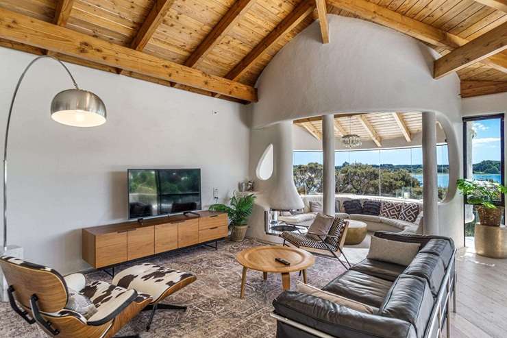 The distinctive waterfront house was designed by renowned Kiwi architect Ian Burrow and sold for just under $2m. Photo / Supplied