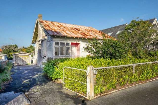 Last dump standing: Family buys run-down Point Chevalier bungalow for $2.205m