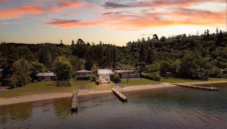 Nestled in the tightly held enclave of Lake Rotoiti’s Hauparu Bay, is Sir David Beattie’s impressive bach. Photo / Supplied