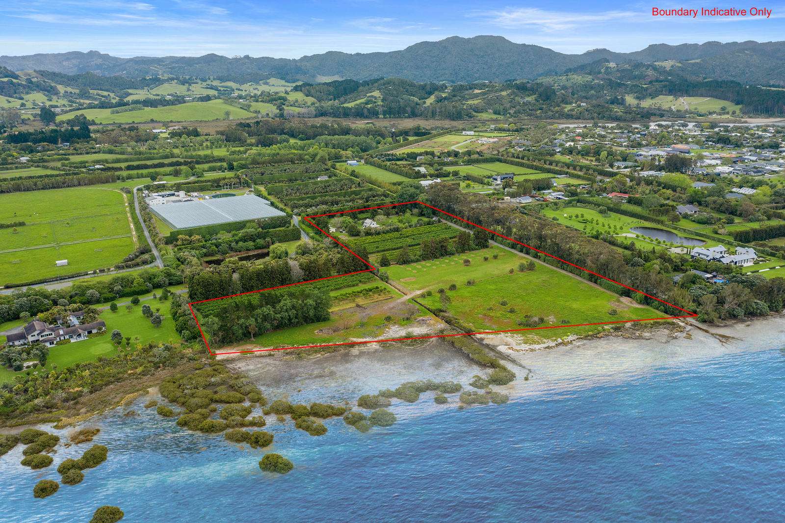 aerial view of orchards, paddocks and luxury houses overlooking harbour. 288 Point Wells Road, Point Wells on Whangateau harbour