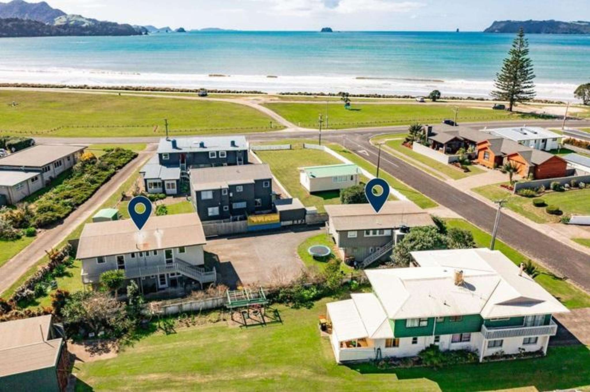 Four neighbouring homes up for grabs at the beach