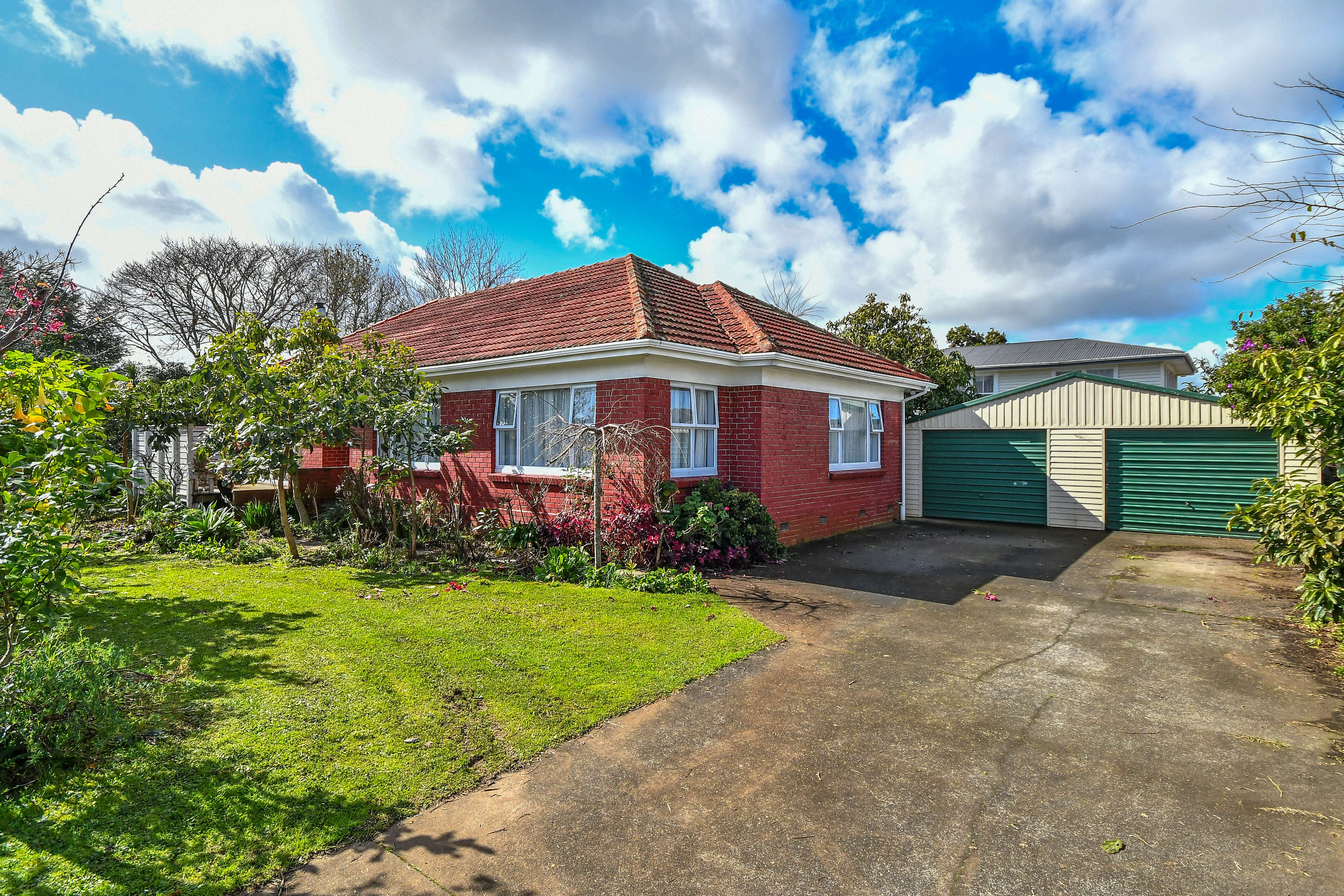 weatherboard house with sunset sky 188 Old Wairoa Road, Papatoetoe, South Auckland