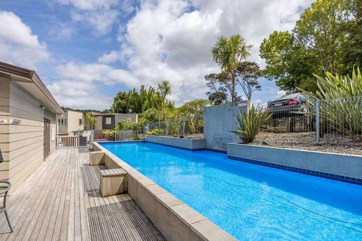 All the expenses on this two-bedroom apartment in the Manuka Cove housing complex are paid by the body corporate for its building manager to live in for the next nine years. Photo / Supplied