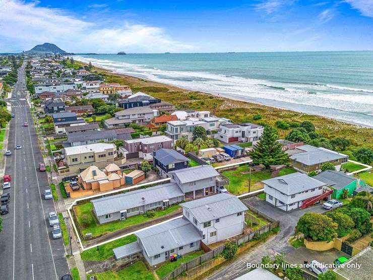A 1960s beachfront bach on Oceanbeach Road, in Mount Maunganui, is up for grabs for the first time since it was built. It is being sold with two neighbouring properties. Photo / Supplied
