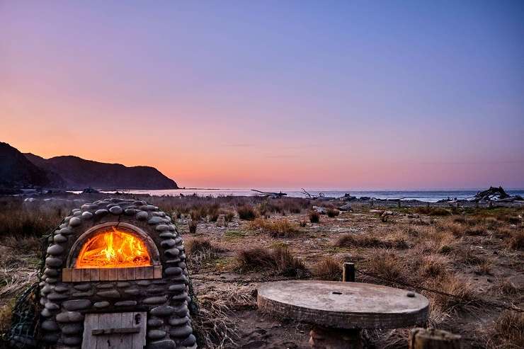 The Mākara shack has no power or water but is the closest property to the beach. Photo / Supplied