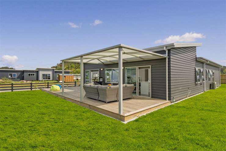 An absolute beachfront home at 22 McCall Avenue, in Pauanui, is one of dozens of Coromandel homes to hit the market recently. Photo / Supplied