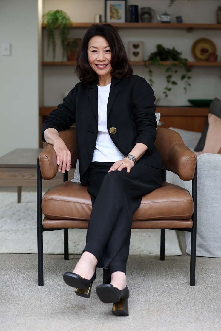 Barfoot & Thompson agent Paul Neshausen is wearing a Dolce & Gabbana sequin suit, a Versace shirt and Gucci shoes. Photo / Fiona Goodall