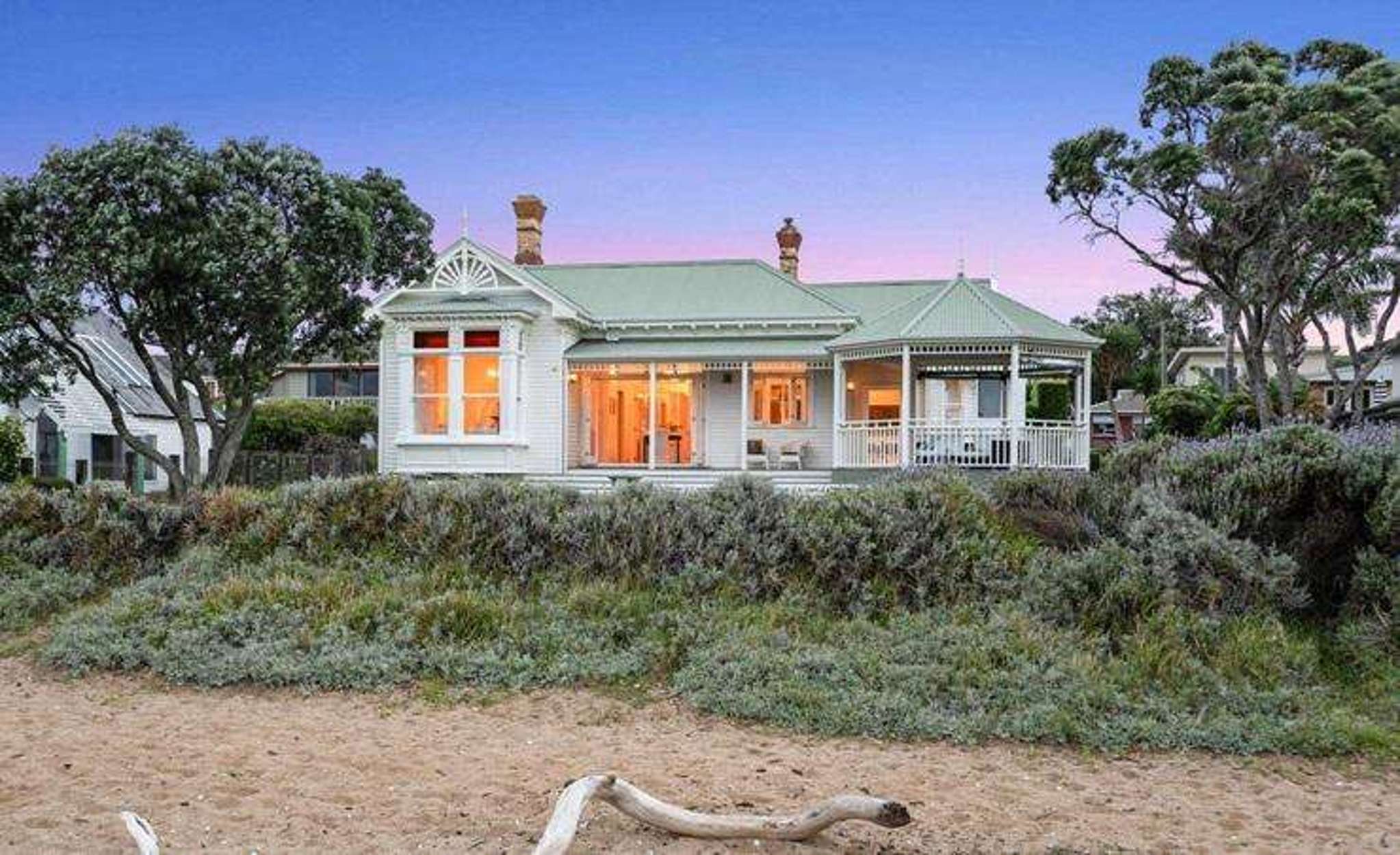Beach stroll ends in house sale: Iconic villa with $8m RV finds new owners