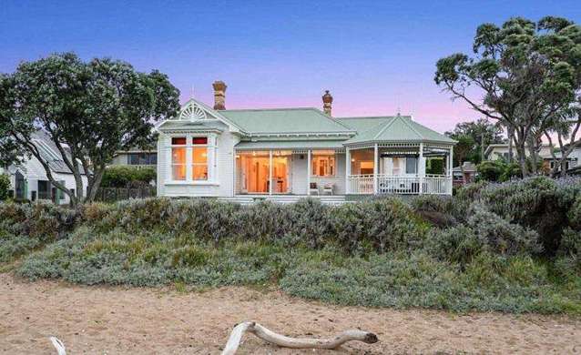 Beach stroll ends in house sale: Iconic villa with $8m RV finds new owners