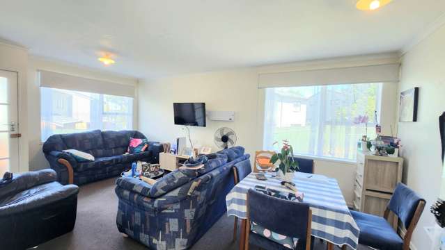 Solid two bedroom unit, in family style block.