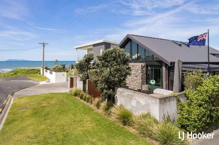 A classic 1960s bach on Broadway Road, in Waihi Beach, sold in a competitive auction for <img.855m. Photo / Supplied