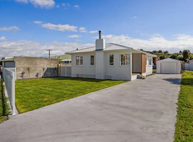 Renovated, sun-filled & full of potential