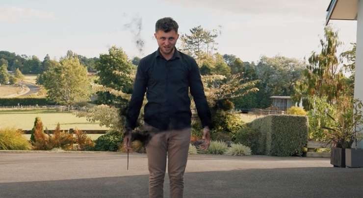 Barfoot & Thompson agent Jason Tabrum hurls lightning bolts and fancy spells at his colleague Luke Jupp in front of a Franklin lifestyle property they were selling. Photo / Supplied