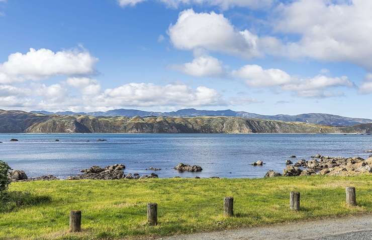 A three-bedroom beach retreat for sale at Breaker Bay makes the most of the view. Photo / Supplied