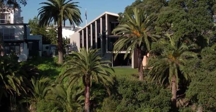 The 1970s beachfront property at 500 Point Chevalier Road has an RV of $5m and is surrounded by impressive homes including a Grand Designs concrete house. Photo / Supplied