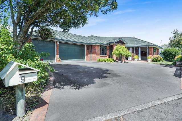 Impeccable Brick Home With 3 Car Garaging!