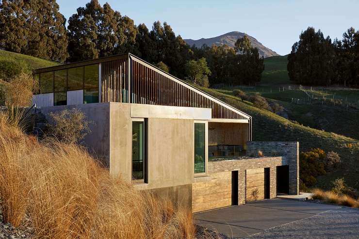 The architecturally designed home is in a much sought-after spot overlooking Lake Hayes, in Queenstown. Photo / Supplied