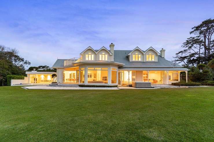 Cars lined the street outside 29 Puriri Road at last weekend's special open home for the property. Photo / Supplied