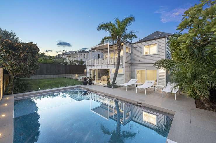 ornate two-storey villa with balcony and brick wall  27 Herne Bay Road, Herne Bay, Auckland