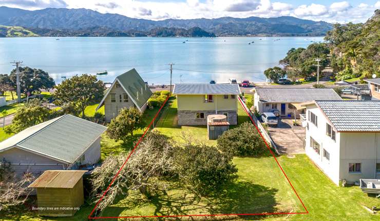 The bach sits on a 835sqm section by the beach in Wyuna Bay, Coromandel