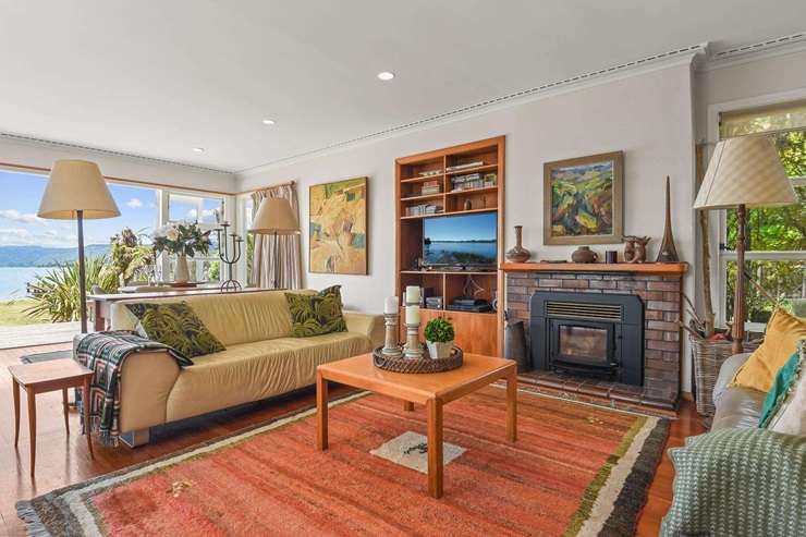 Nestled in the tightly held enclave of Lake Rotoiti’s Hauparu Bay, is Sir David Beattie’s impressive bach. Photo / Supplied