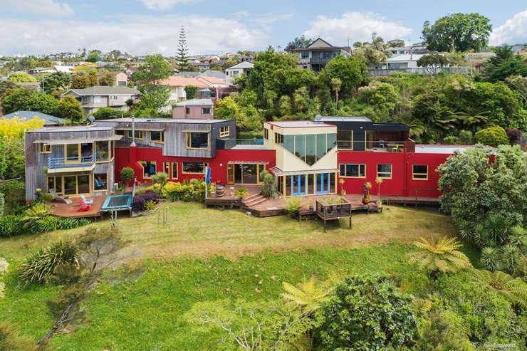 The colourful 133 West Harbour Drive, left, and the rundown 1/125 West Harbour Drive, both in Auckland's West Harbour, are up for grabs. Photo / Supplied