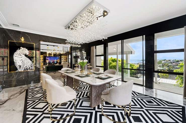 living room with black and white rug marble walls  24 Half Moon Rise, Half Moon Bay, Auckland