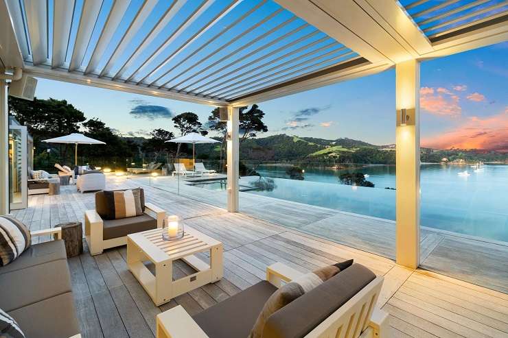 white pavilion house with glass roof and infinity pool  729 Orapiu Road, Omaru Bay, Waiheke Island Auckland