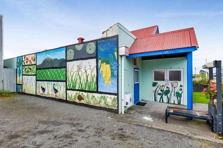 The former Freemason's hall at 20 Domett Street, in the Taranaki town of Waitara, has been given a colourful makeover. Photo / Supplied