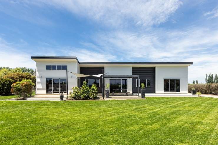 A property investor has bought the flood-damaged Swamp Road property and plans to fix and flip it. Photo / Supplied