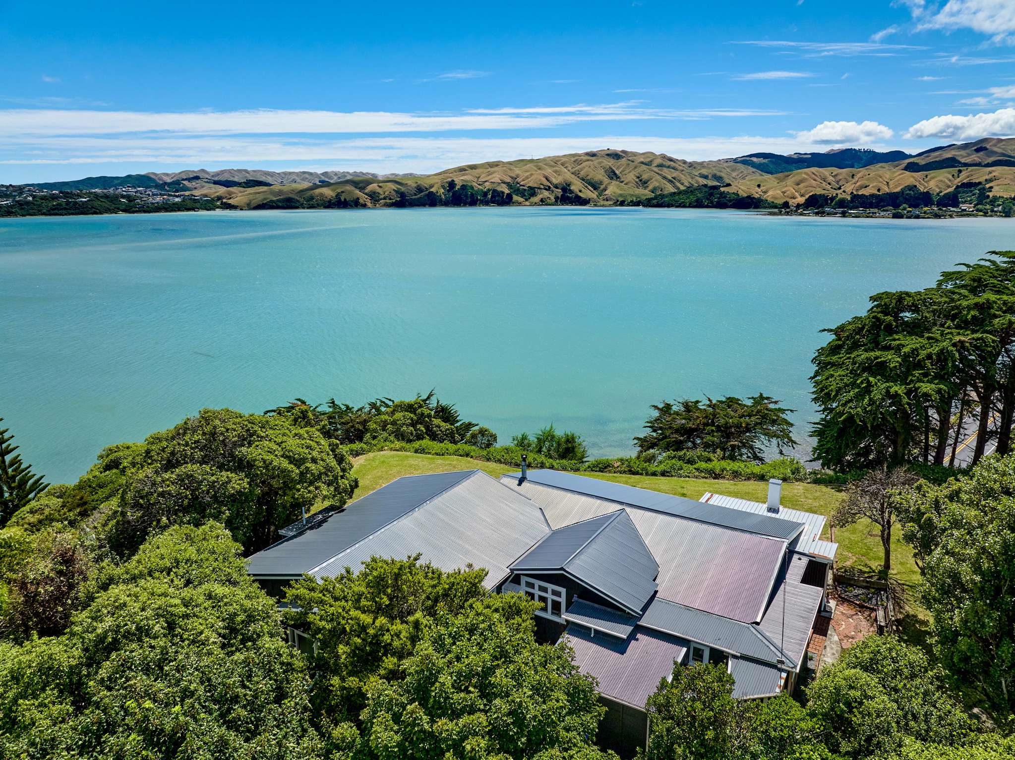 Asbestos-clad bach in Porirua sells for $2.1m - double its RV