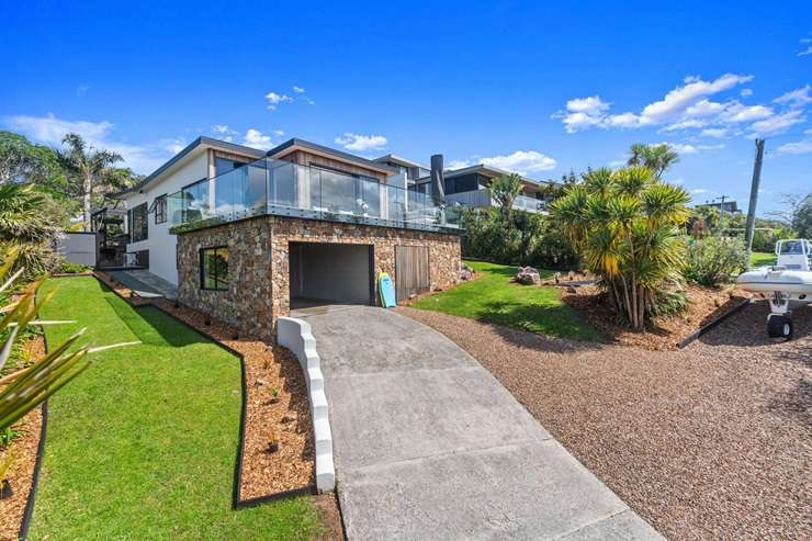 A beachfront property in Arran Bay with its own boatshed and mooring sold under the hammer for $2.765m. Photo / Supplied