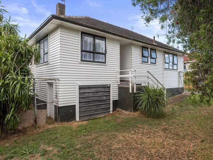 blue swimming pool in front of 1970s brick house 116 St Andrews Road,Epsom, AUckland