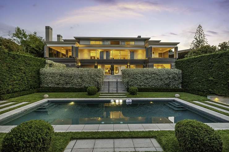 White tuscan-style mansion with cypress trees, lawn and clipped hedges 120 Victoria Avenue, Remuera