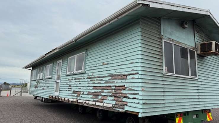 Eleven students from Trident High School, in Whakatāne, have spent the last eight months renovating an old smoko house. Pictured is tutor Hamish Galloway with some of the students. Photo / Boundless Vision and The Northern Group