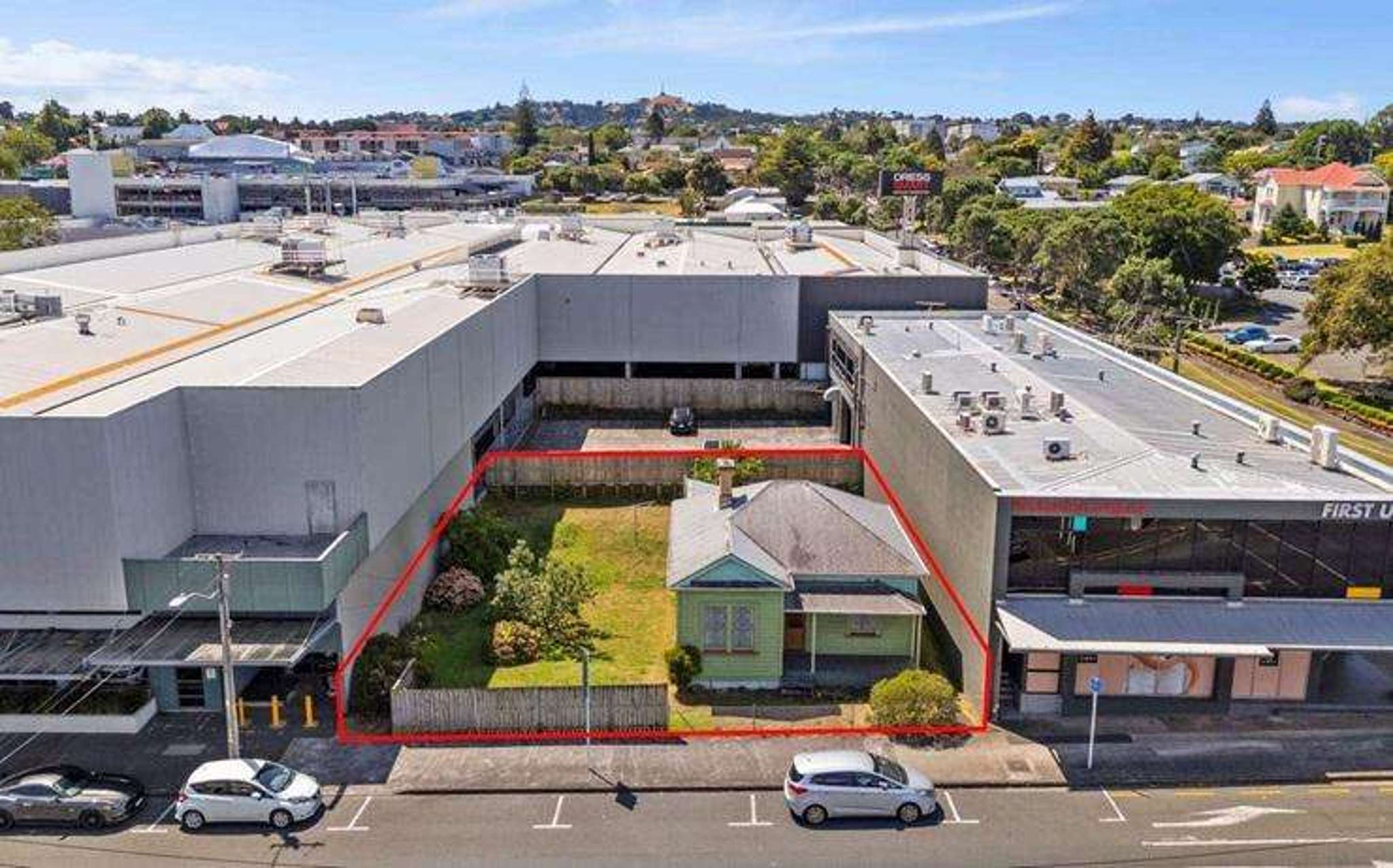 NZ’s ‘Up’ house sells: Villa wedged in middle of Dress Smart snapped up for under $1.2m