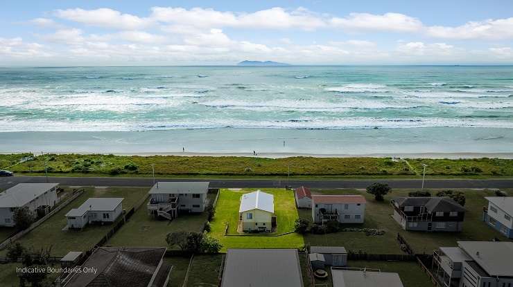 A classic 1960s bach on Broadway Road, in Waihi Beach, sold in a competitive auction for <img.855m. Photo / Supplied