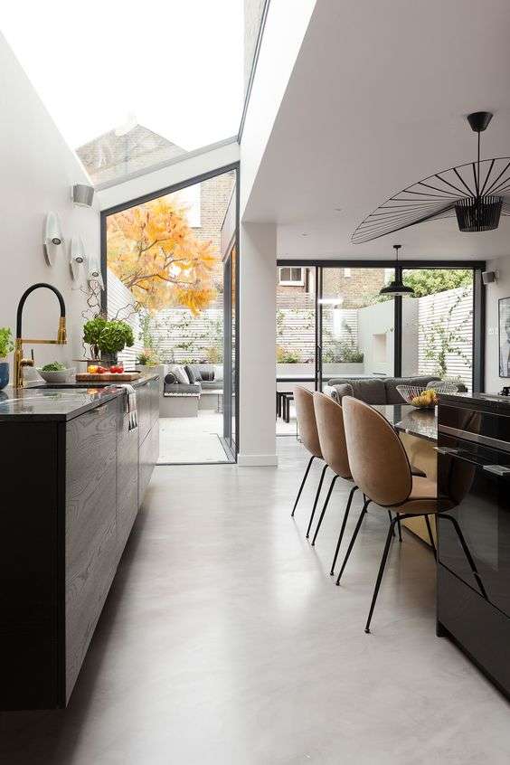 Red brick house with glass, iron extension