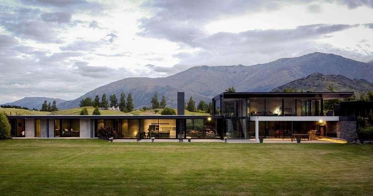 The architecturally designed home is in a much sought-after spot overlooking Lake Hayes, in Queenstown. Photo / Supplied