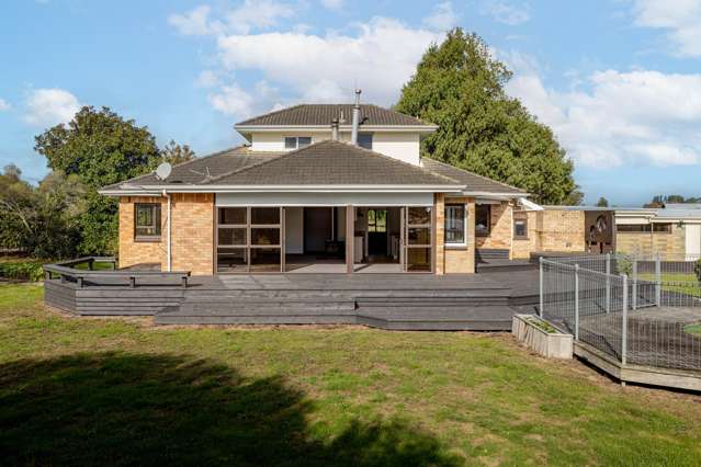 Brick home plus large shed/stables on flat land.
