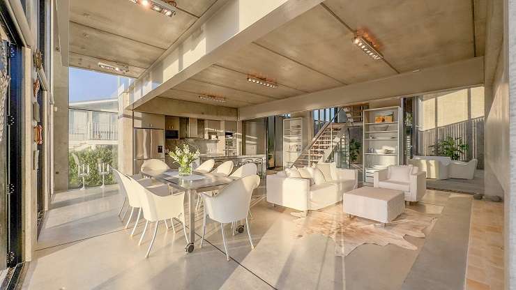 A concrete and glass beach home at Beverley Terrace, in Whangamatā, sold in December. It had a RV of $6.45m. Photo / Supplied