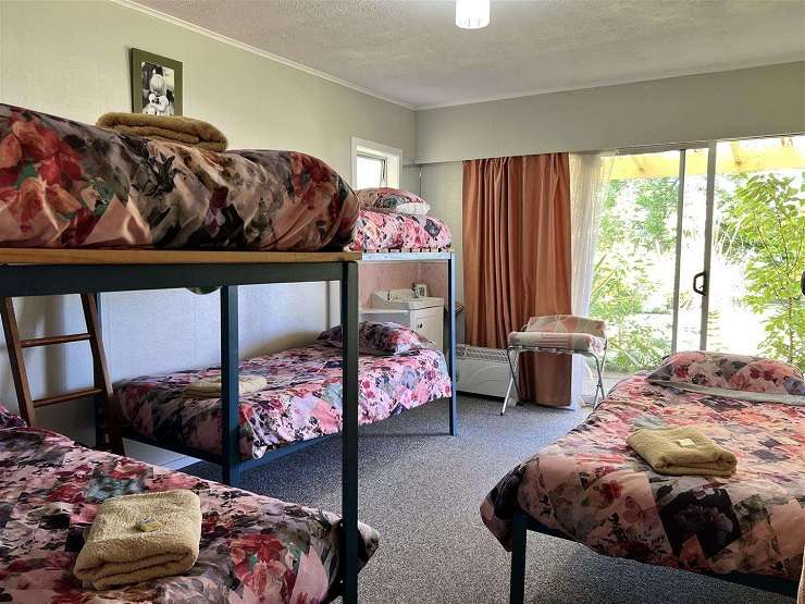 The property at 8 Hilton Street, in Blackball, which has an owner's flat, motel rooms and pub, is for sale for $450,000. Photo / Supplied