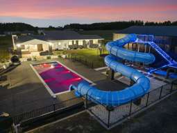 Mum and dad build epic 36m, glow-in-the-dark waterslide in their backyard