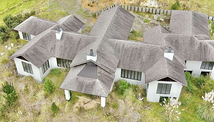 The mock Tudor home on Kaipara Lake Road, in South Head, Auckland, has been the talk of the region for more than a decade. Photo / Supplied